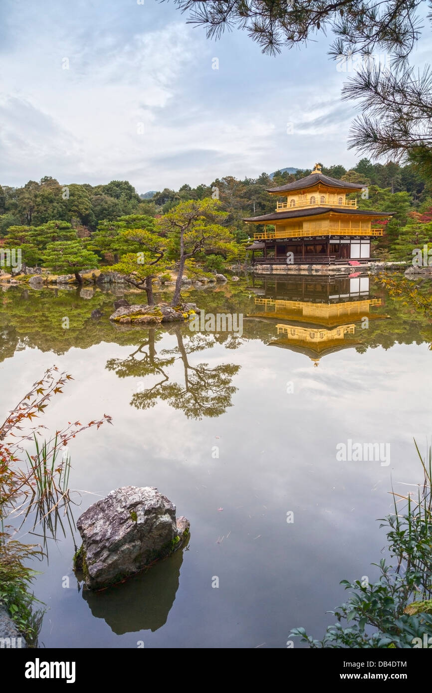 The Golden Pavilion of the temple of Kinkaku-ji or Rokuon-ji in Kyoto, seen in autumn. This Zen Buddhist temple is one of the... Stock Photo