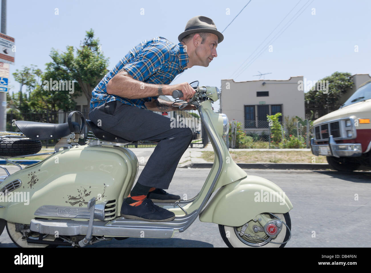 SILVERLAKE, CA JULY 3  - Aaron Rose riding a moped in Silverlake, California on July 3, 2008. Stock Photo