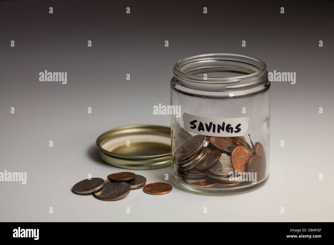 Glass jar of coins for savings - USA Stock Photo