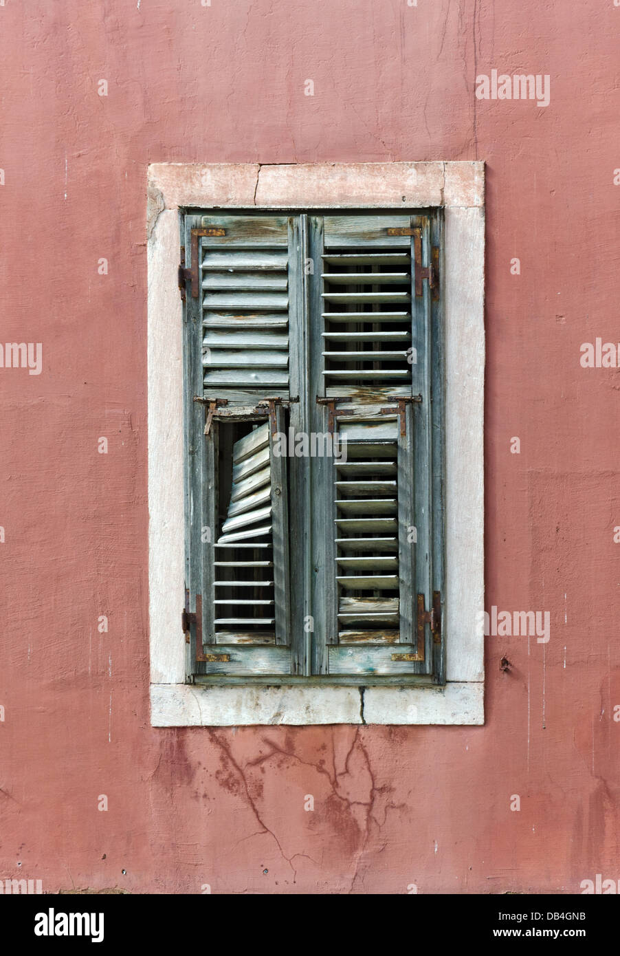 damaged lattice window with the Croatian town of Sibenik Stock Photo