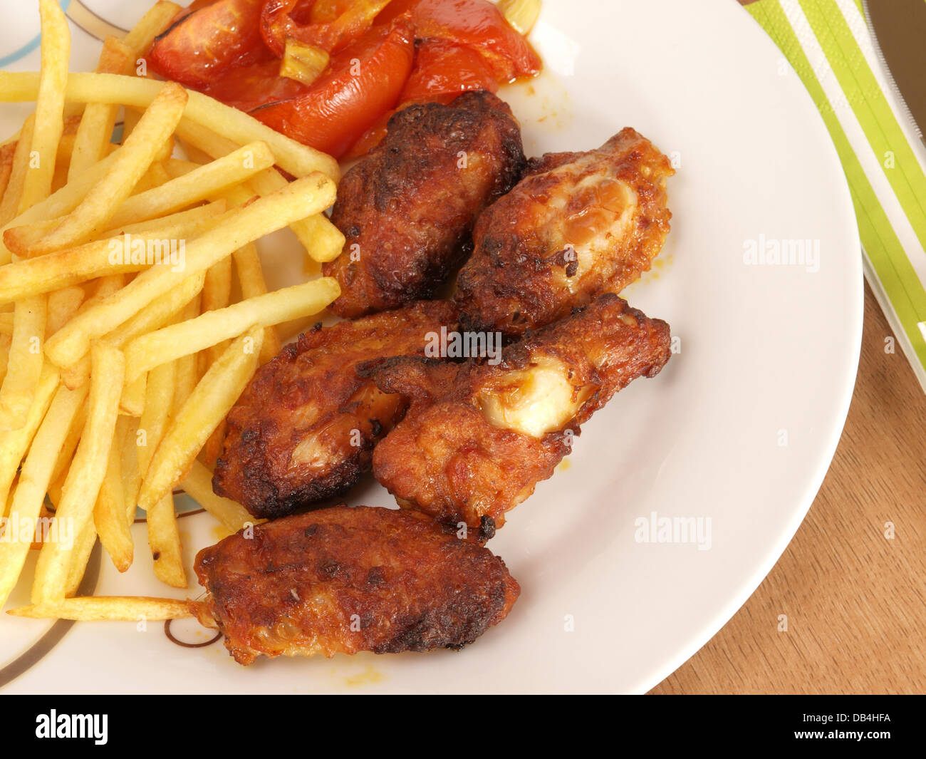 Spicy chicken wings with curry tomato sauce Stock Photo Alamy