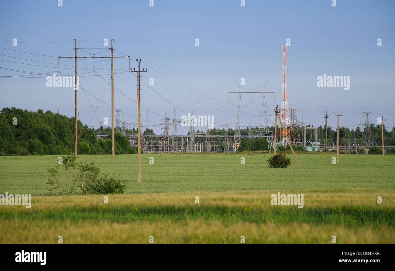 Transmission power towers in the meadow Stock Photo Alamy