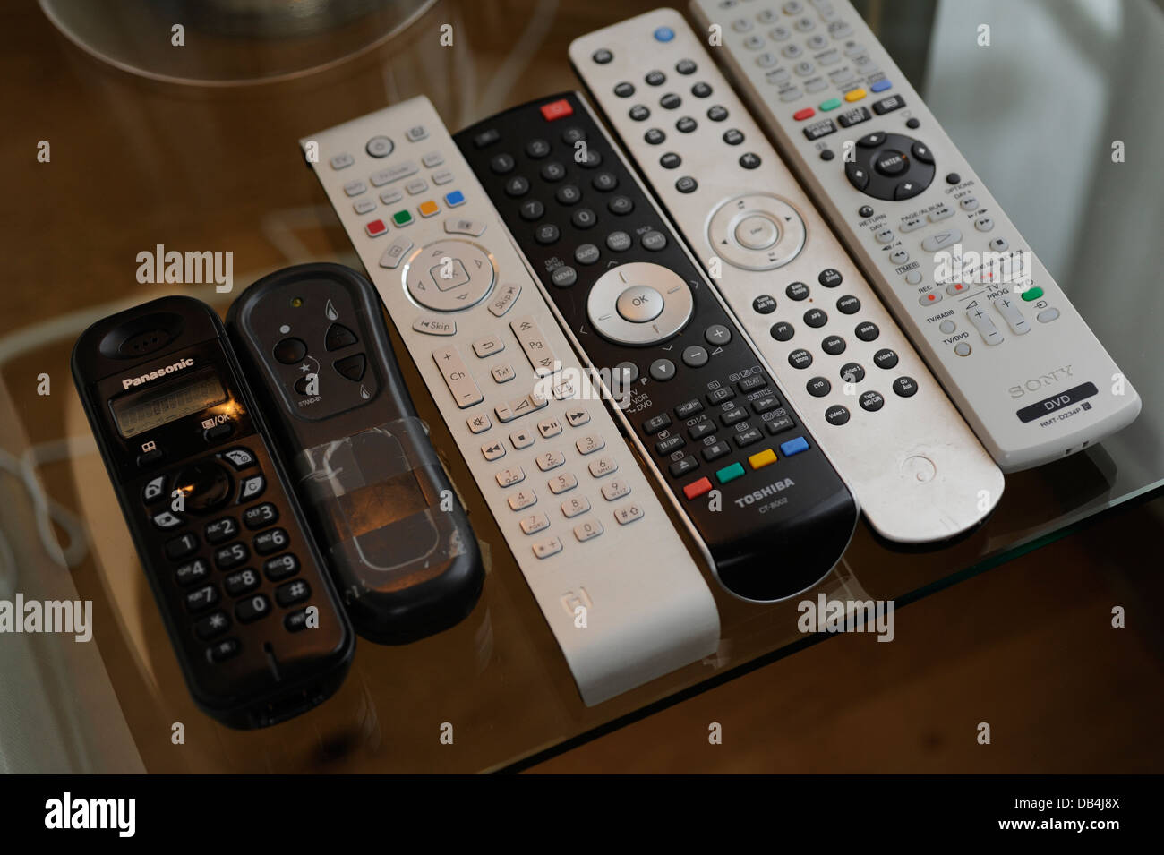 Remote controls for TV/ Sky/ DVD/ etc in a home Stock Photo Alamy