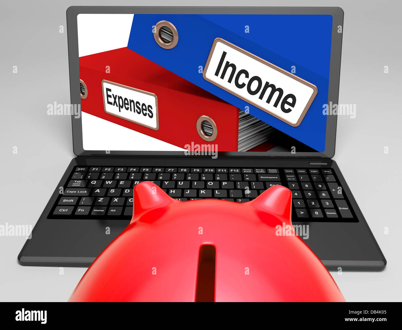 Incomes And Expenses Files On Laptop Showing Earnings Stock Photo