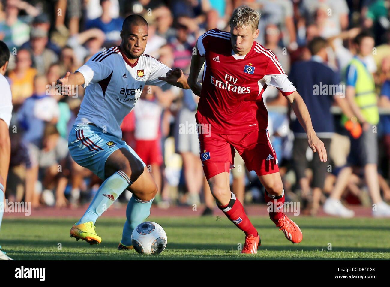 Flensburg, Germany. 23rd July, 2013. United's Winston Reid (L) vies for the ball with Hamburg's Artjoms Rudnevs during the soccer test match between Hamburger SV and West Ham United at Stadium Arndstrasse in Flensburg, Germany, 23 July 2013. Photo: Malte Christians/dpa/Alamy Live News Stock Photo