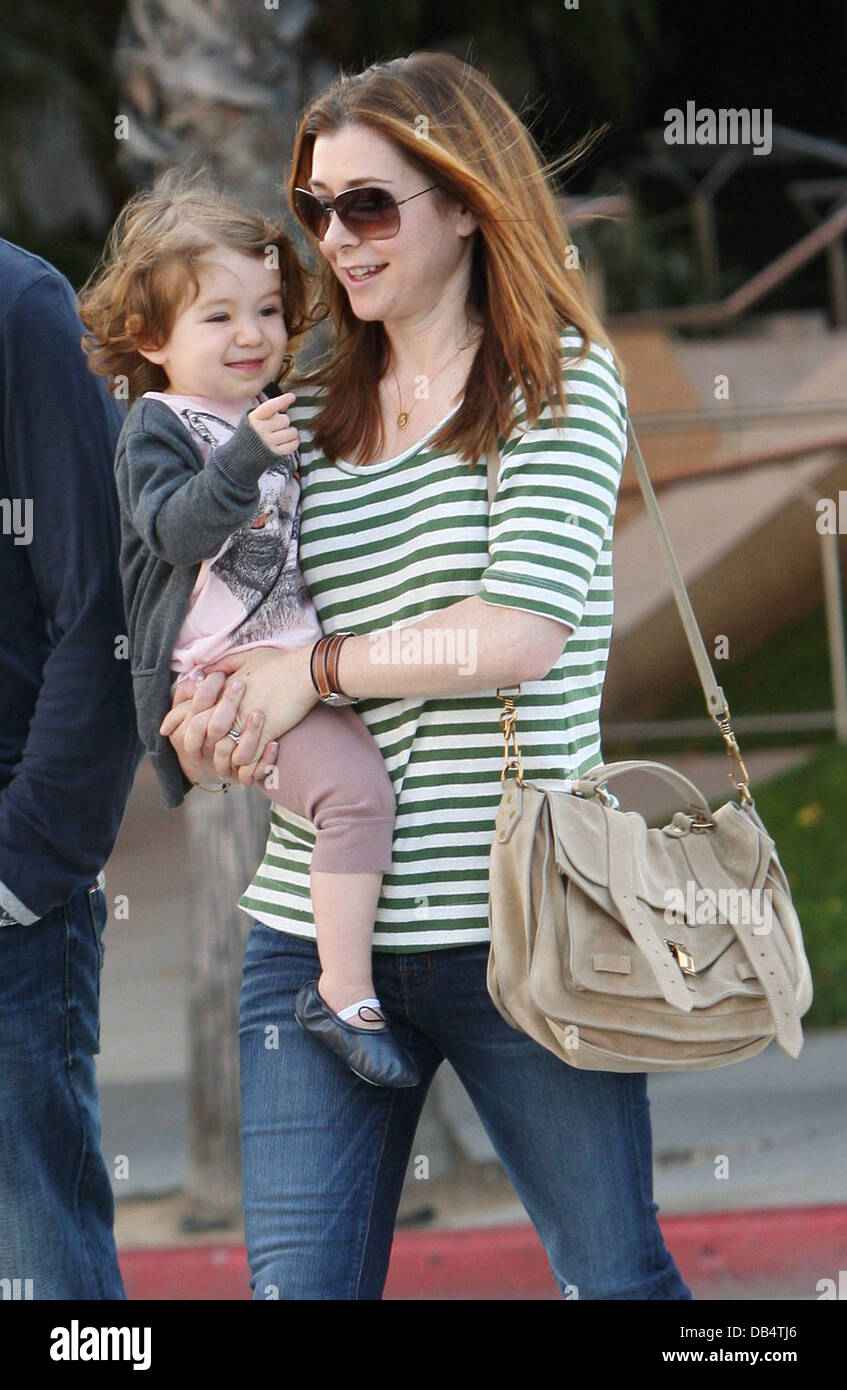 Alyson Hannigan and her daughter Satyana Marie Denisof walking in Santa
