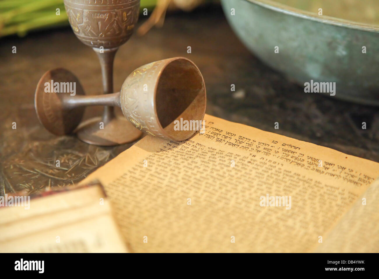 Ancient Kiddush cup and Tehilim (Psalms) book, at the Babylonian Jewry heritage center Stock Photo