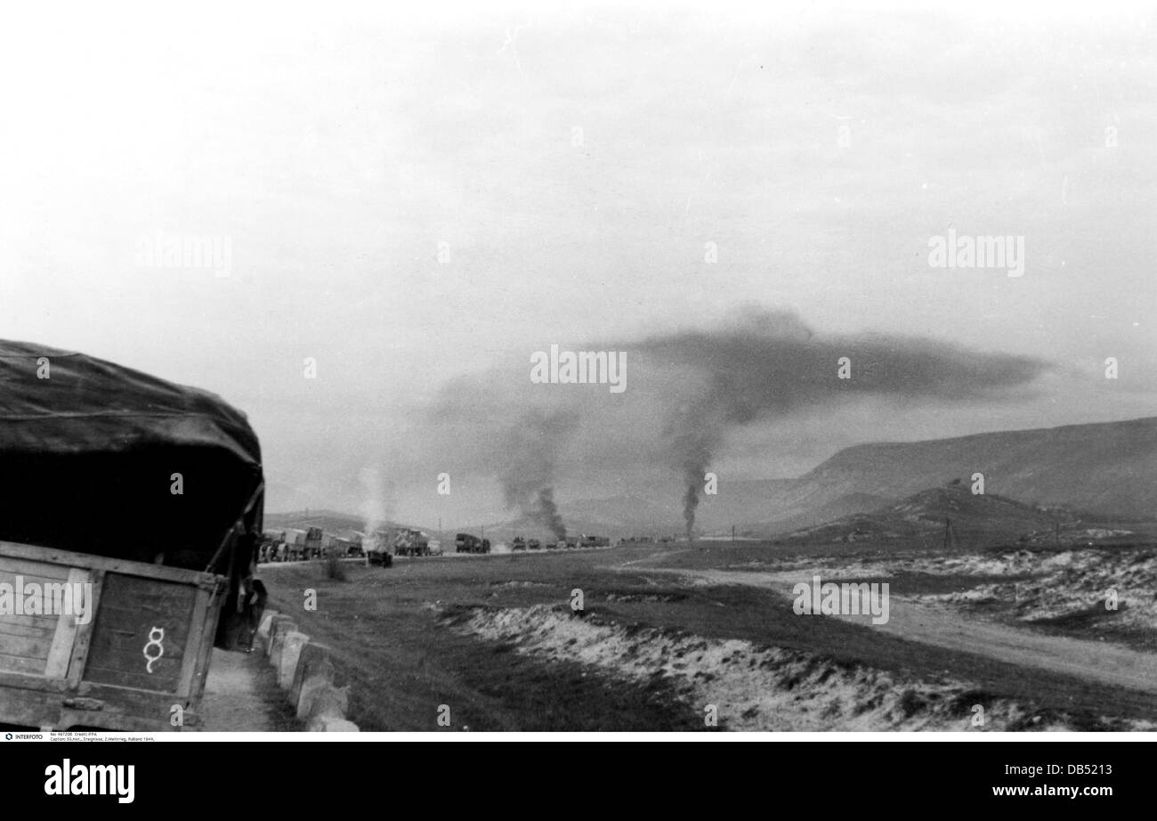 events, Second World War / WWII, Russia 1944 / 1945, Crimea, Sevastopol, transport column of the German 98th Infantry Division under Soviet artillery fire, 26.4.1944, Eastern Front, USSR, Wehrmacht, retreat, lorry, lorries, road, Divisional sign, signs, emblem, emblems, cloud, clouds of smoke, Soviet Union, 20th century, historic, historical, vehicles, people, 1940s, Additional-Rights-Clearences-Not Available Stock Photo