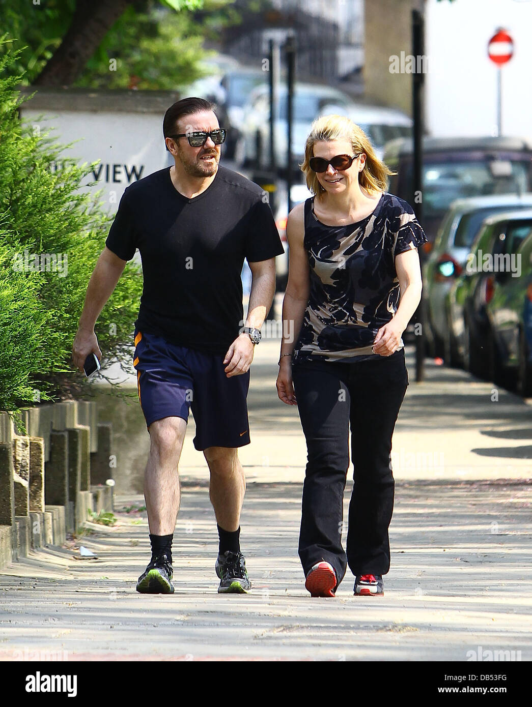 Ricky Gervais and his girlfriend Jane Fallon take a walk through a