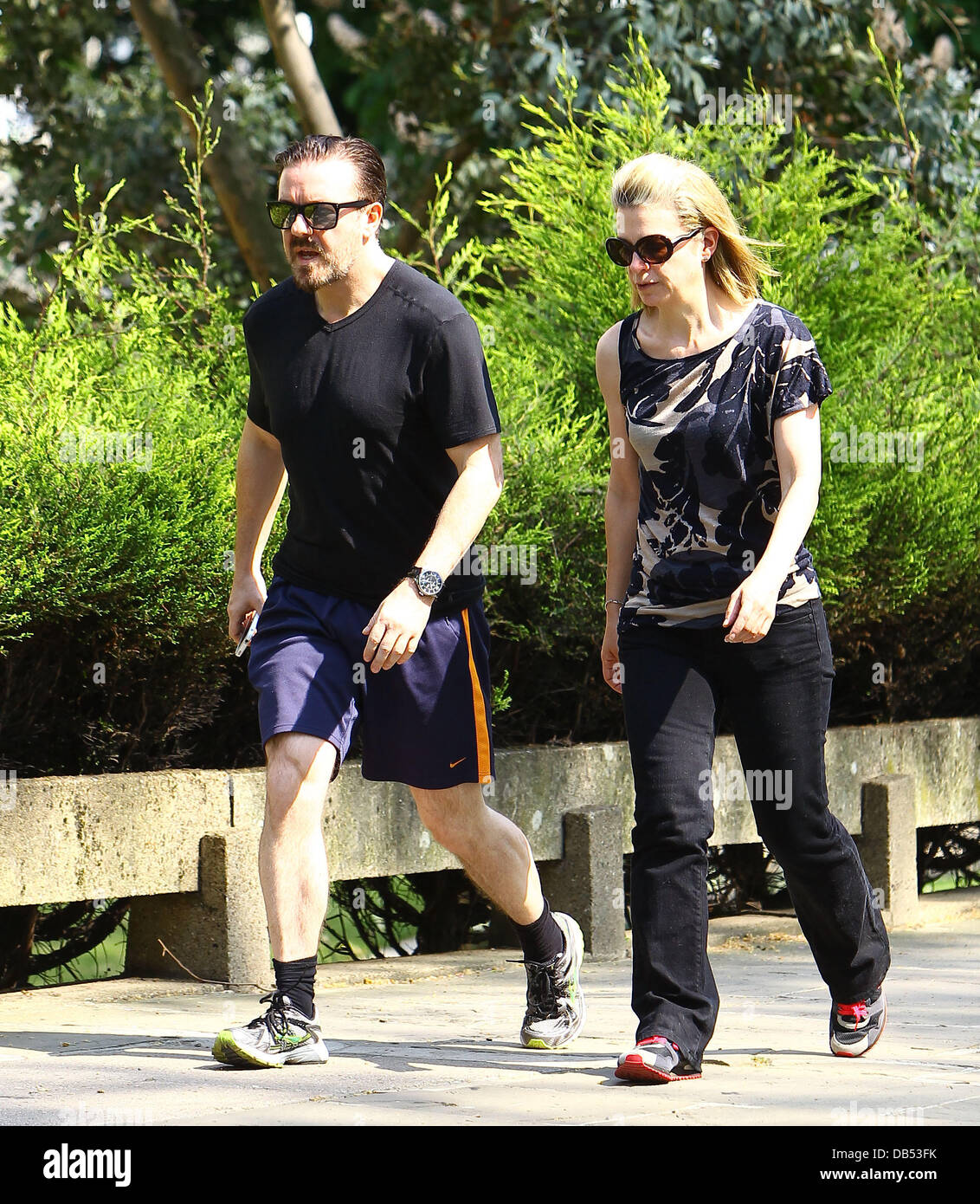 Ricky Gervais and his girlfriend Jane Fallon take a walk through a