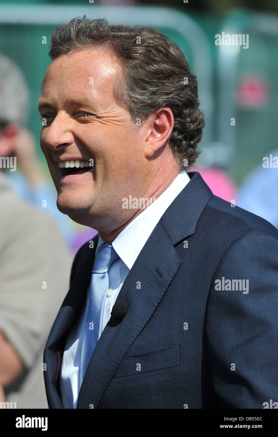 Piers Morgan is seen making a television programme at Buckingham Palace ...