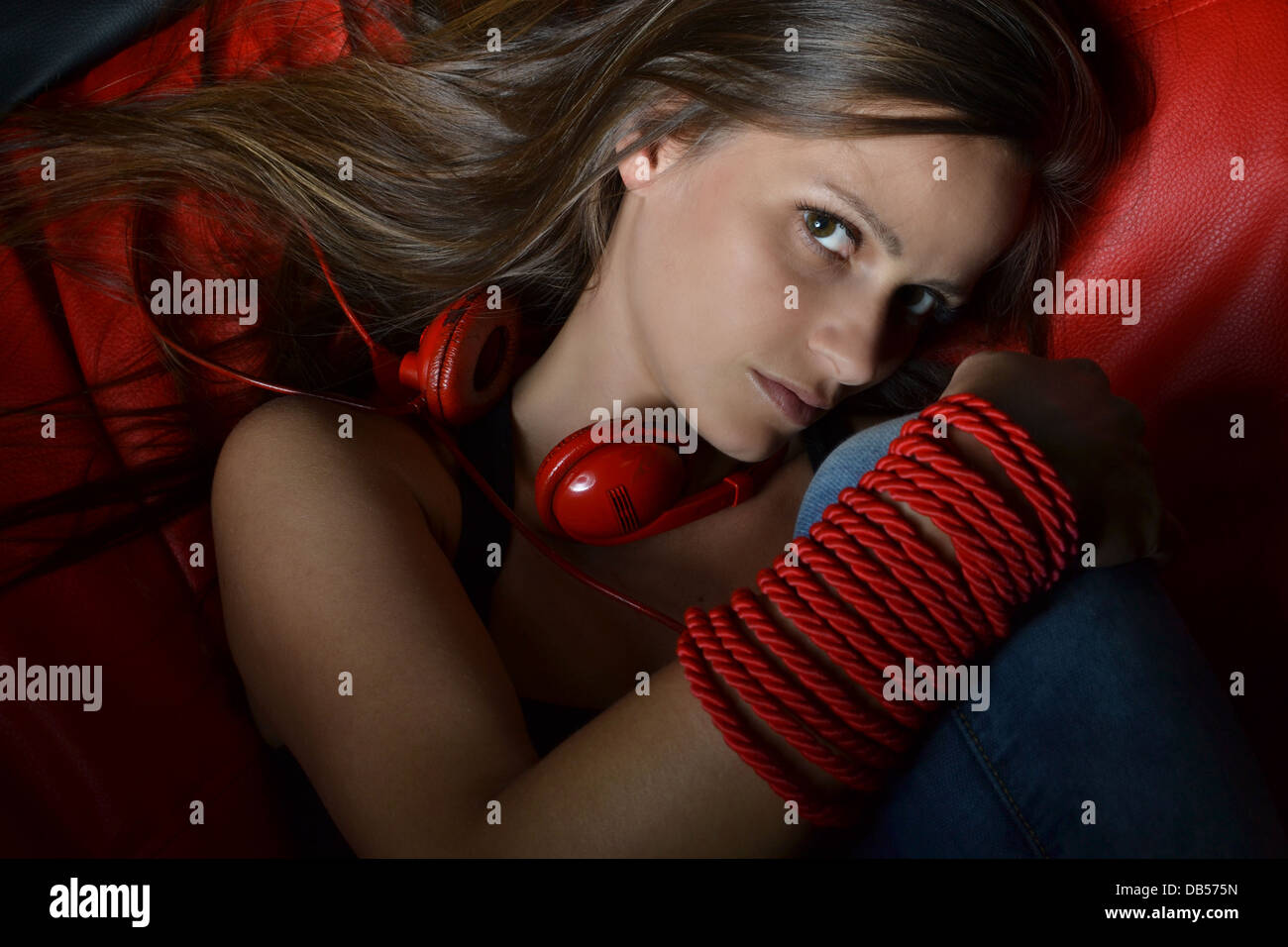 A beautiful young woman with the red headphones Stock Photo