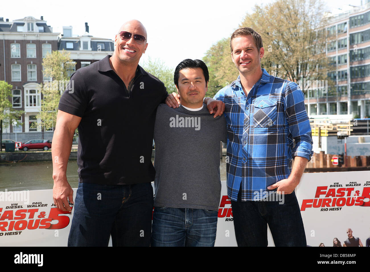 Dwayne Johnson, aka The Rock, Director, Justin Lin and Paul Walker attend a Photocall for 'Fast & Furious 5: Rio Heist' outside the Pathe Arena Amsterdam, Netherlands - 26.04.11 Stock Photo