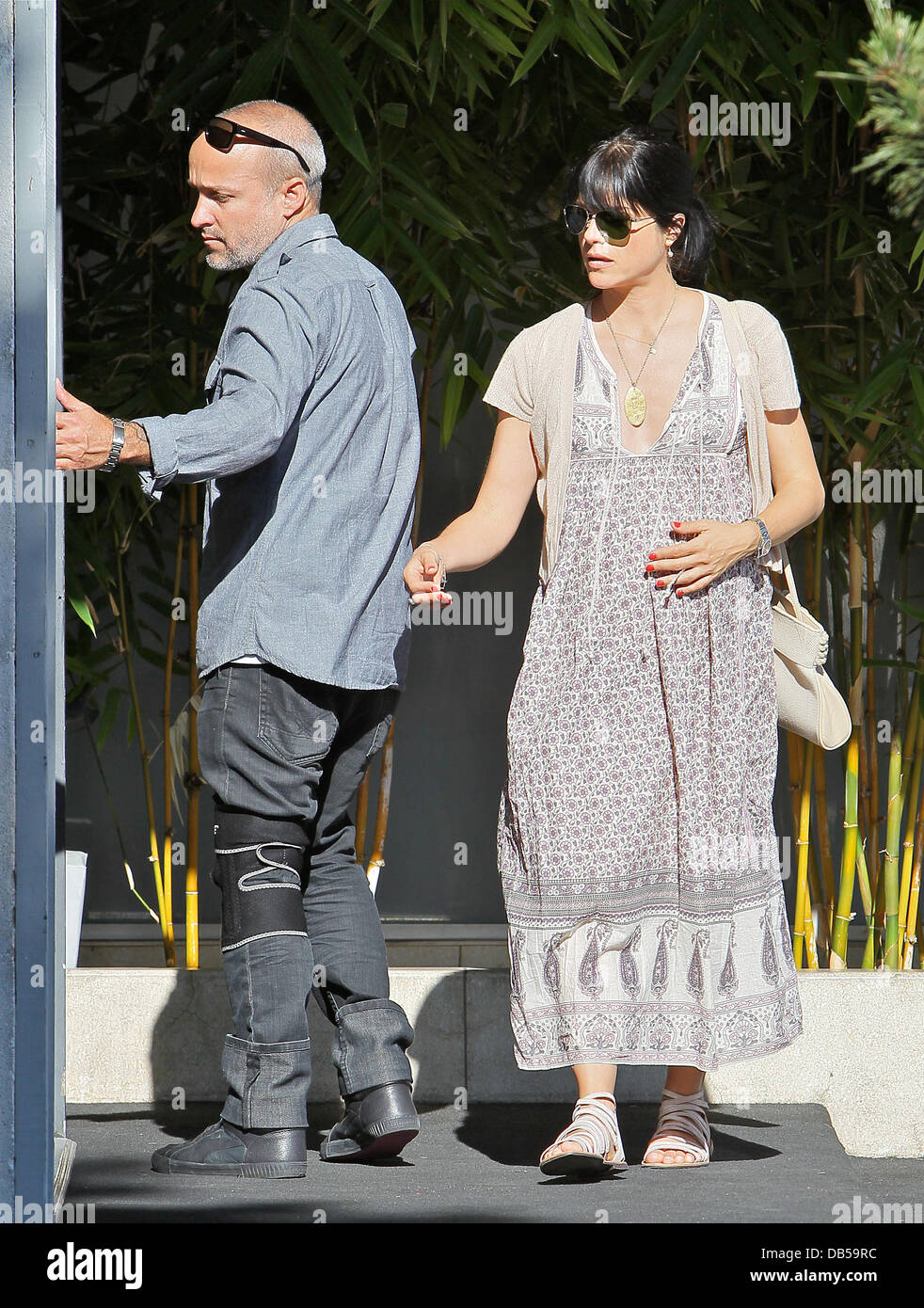 Heavily pregnant Selma Blair in a floralprint dress and sandals with