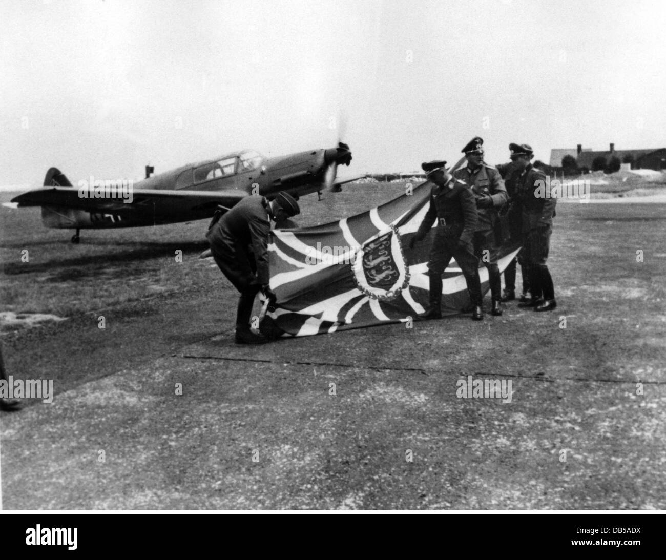 events, Second World War / WWII, Channel Islands, Guernsey, German soldiers with a captured British flag, summer 1940, Great Britain, England, Island, 20th century, historic, historical, officers, uniform, uniforms, airfield, aircraft, Arado Ar 96, Ar96, Ar-96, Wehrmacht, Luftwaffe, people, 1940s, Additional-Rights-Clearences-Not Available Stock Photo