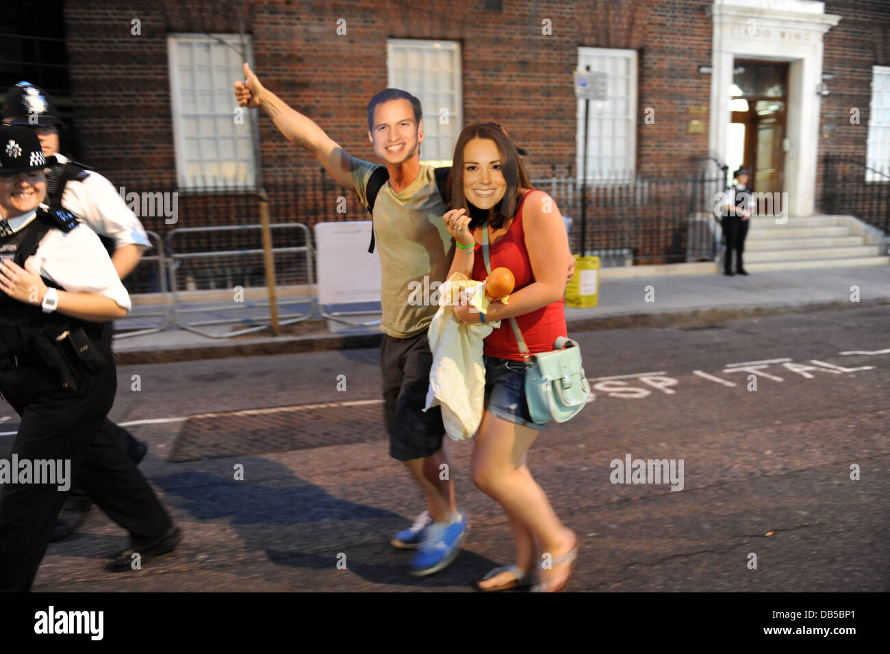 Two Tourists Wearing Face Masks Of Prince William And Princess Kate Waiting For News Of The Royal Baby Outside St Marys Hospital Stock Photo Alamy