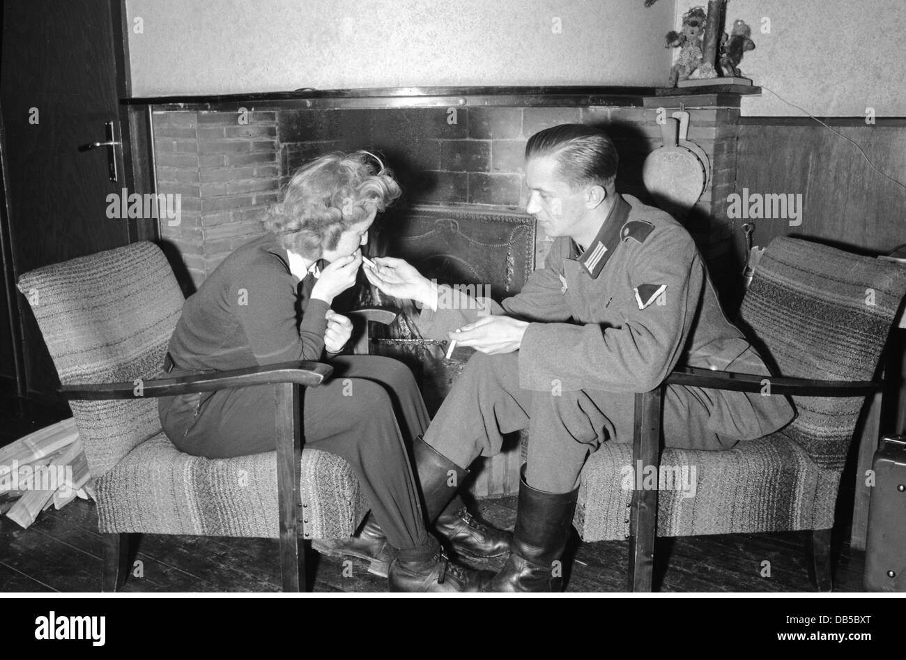 events, Second World War / WWII, Germany, Wehrmacht soldier with a woman in front of a fireplace, circa 1941, Additional-Rights-Clearences-Not Available Stock Photo