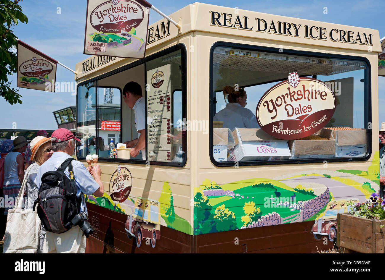 People visitors buying Ice cream at van in summer at the Great Yorkshire Show Harrogate North