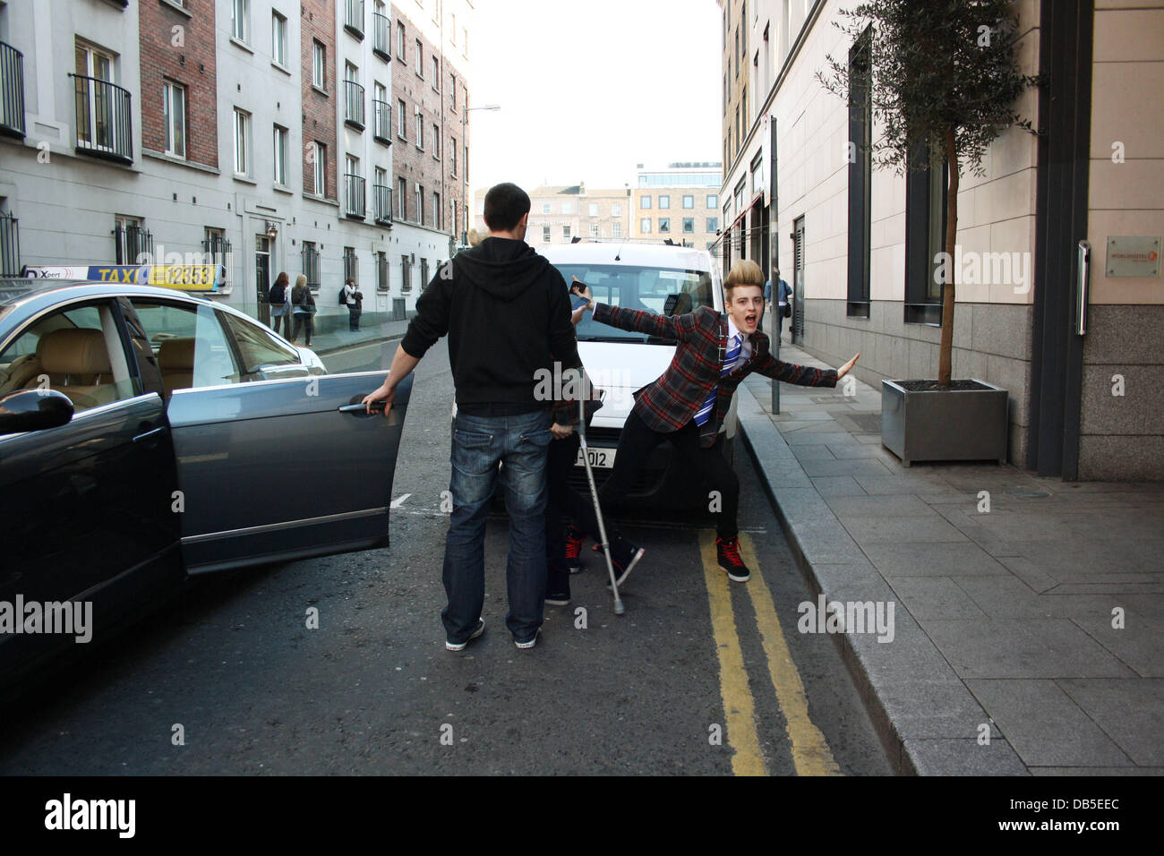 Irish Eurovision Hopefuls Jedward aka John Grimes and Edward Grimes (Edward on Crutches) leaving
