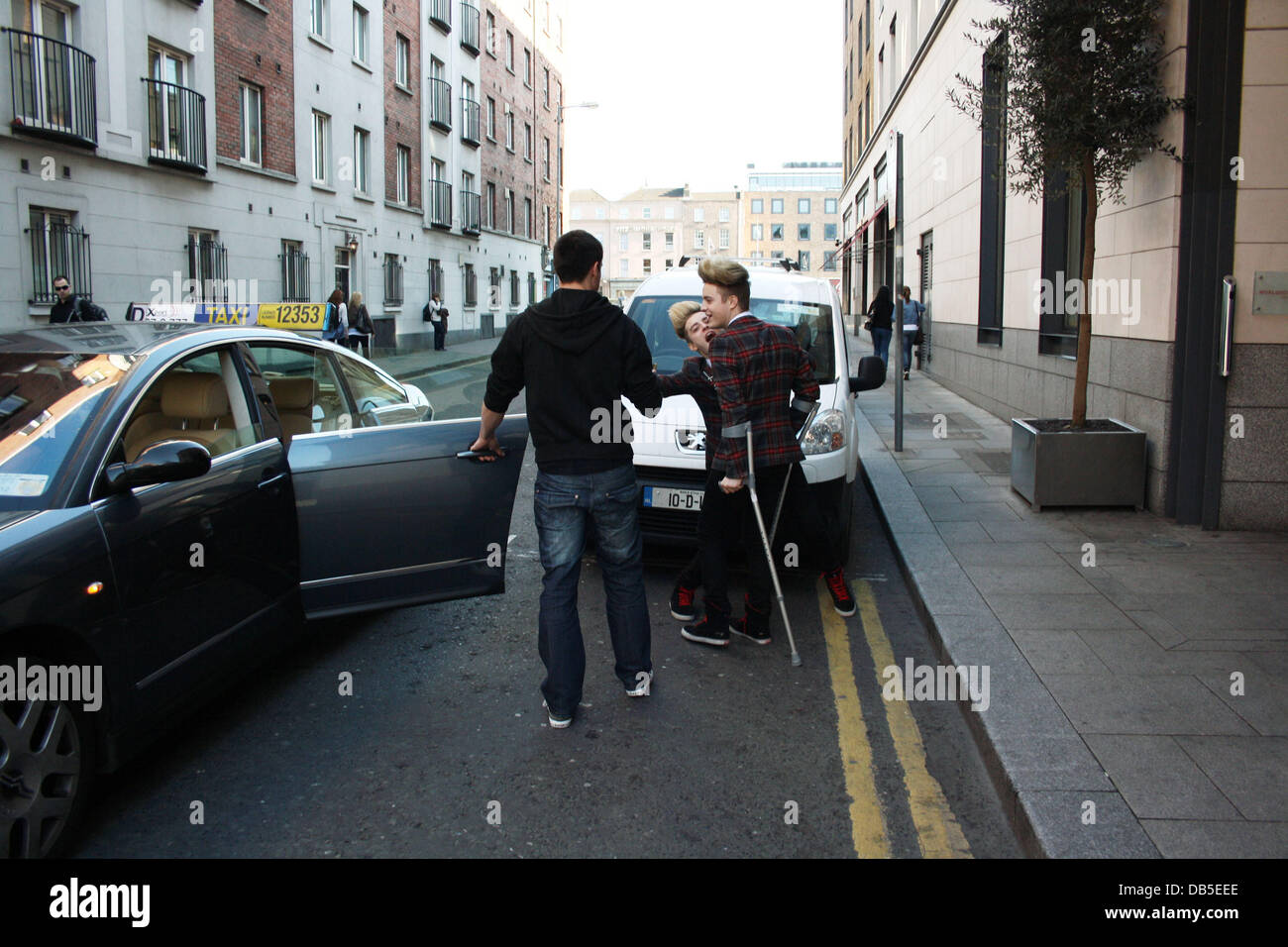 Irish Eurovision Hopefuls Jedward aka John Grimes and Edward Grimes (Edward on Crutches) leaving