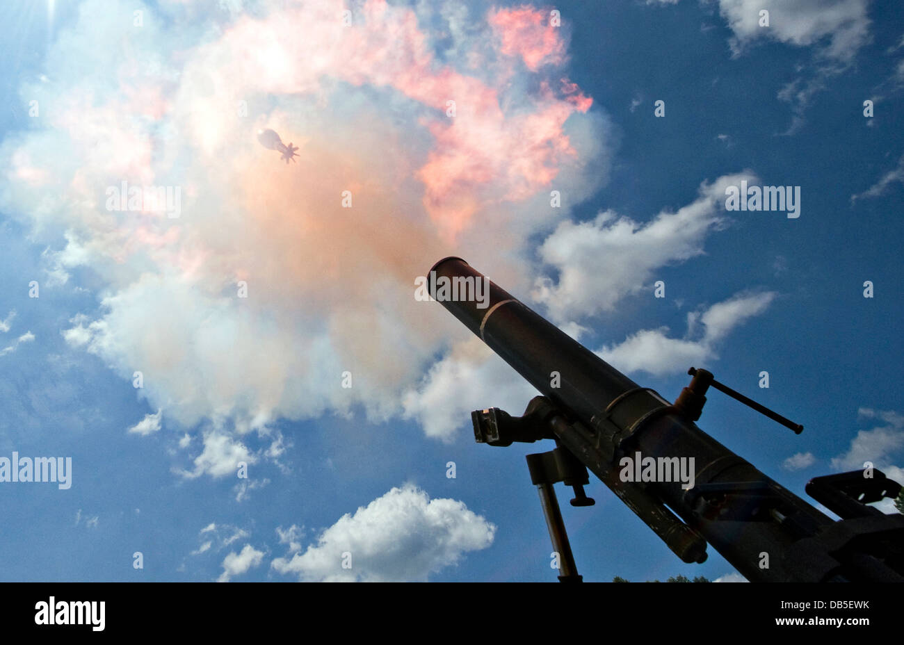 A 120mm mortar leaves the tube, fired by Soldiers of Headquarters Company July 13, 2013 at Atterbury-Muscatatuck, near Edinburgh, Indiana. Stock Photo