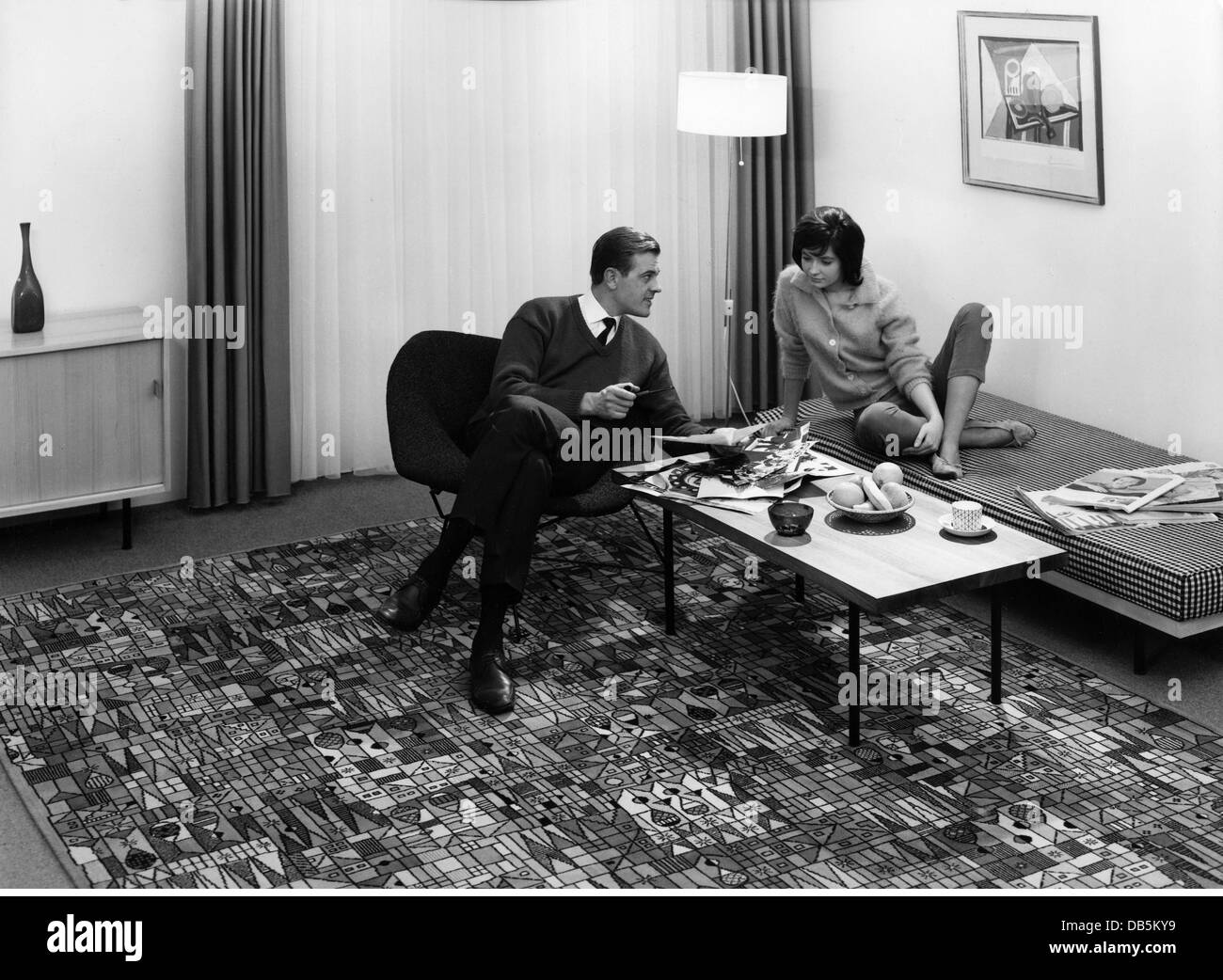 people, couples, couple sitting around side table, circa 1960