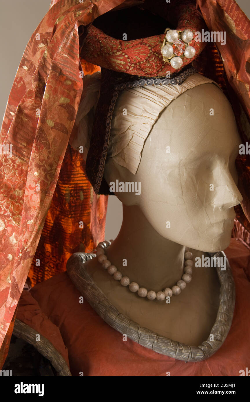 Headdress detail of mannequin in paper dress costume Stock Photo