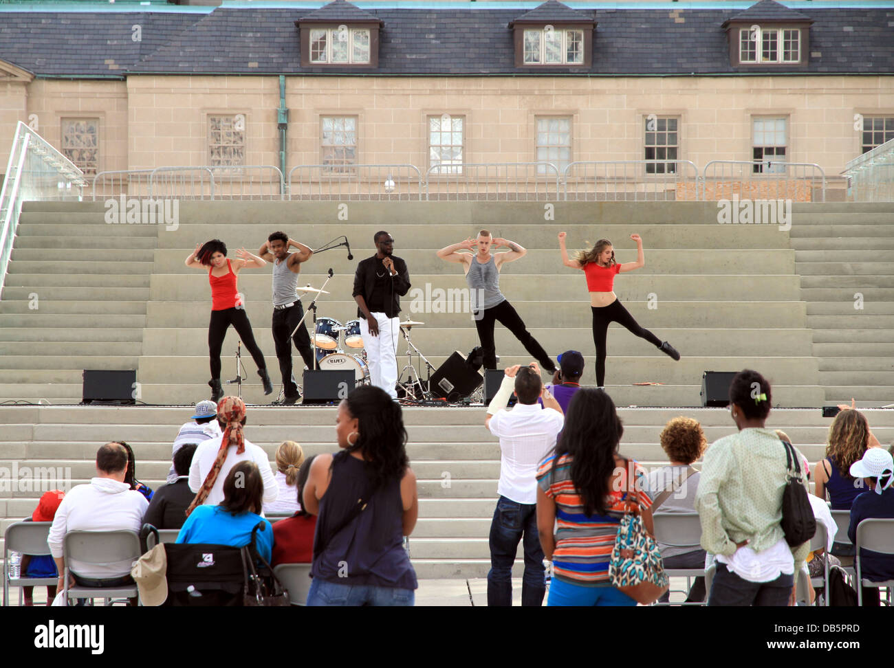Singer and dancers on stage during a festival in Nathan Phillips Square on July 12, 2013 in Toronto Stock Photo