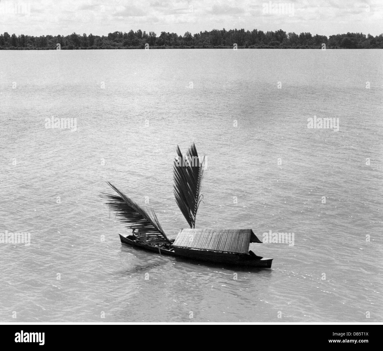 geography / travel, Papua New Guinea, traffic / transport, boat with palm-branches as sails and a bamboo awning as sun protection, 1950s, Additional-Rights-Clearences-Not Available Stock Photo