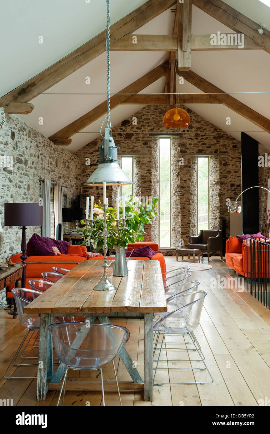18th century Devon long barn conversion with mezzanine floor furnished with an eclectic mix Stock Photo