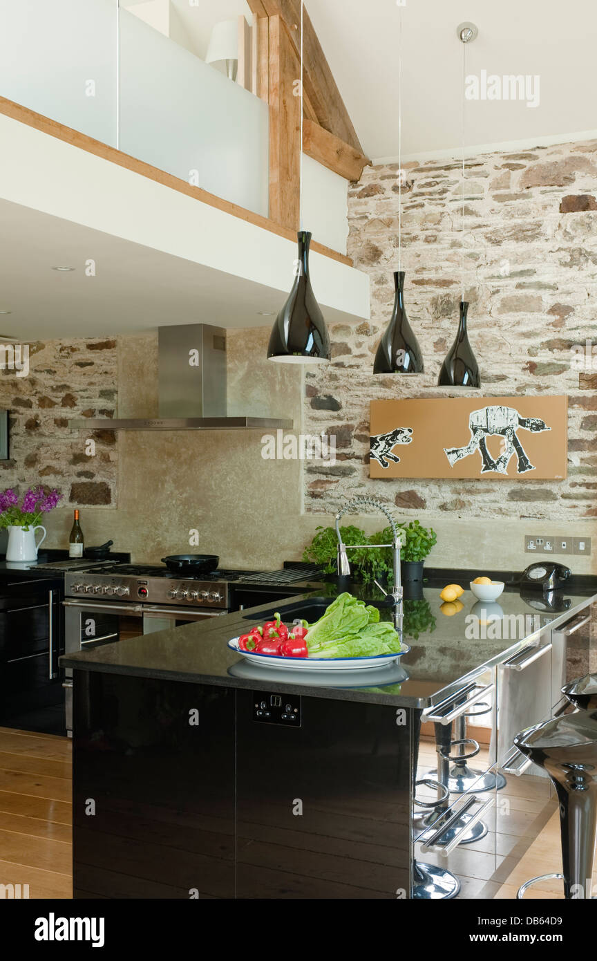 Shiny black lacquer units from teamed with black granite worktops in 18th century long