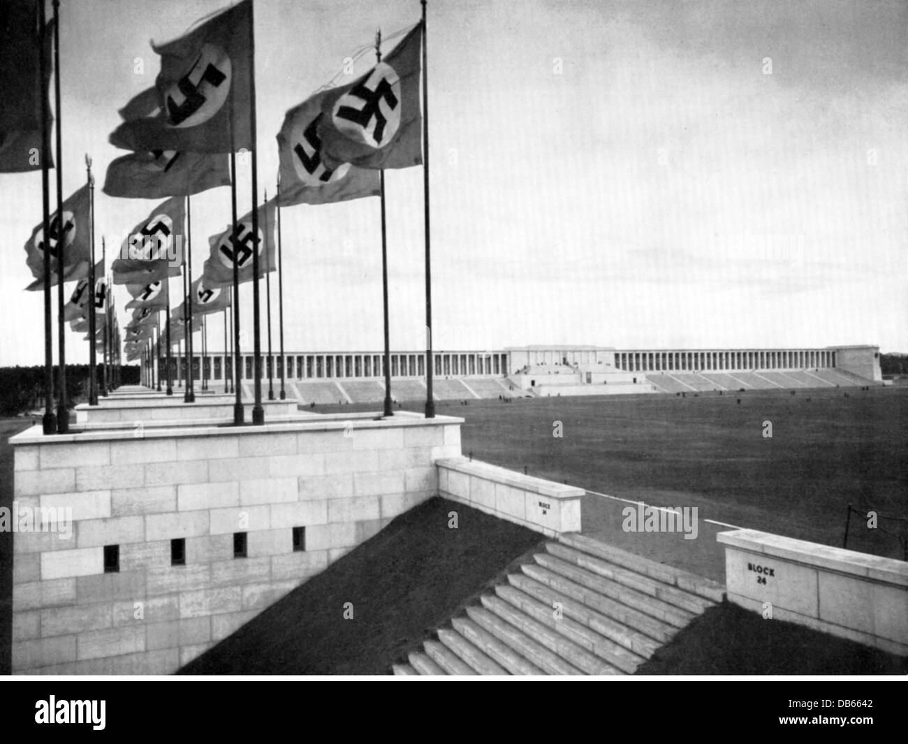 National Socialism, architecture, grandstand of Zeppelin Field, Reichsparteitagsgelaende (Nazi party rally grounds), Nurembenrg, built 1935 - 1937, architect: Albert Speer, view, 1937, flags, flag tower, swastika, building, Nazi Germany, German Reich, Third Reich, 1930s, 20th century, historic, historical, Additional-Rights-Clearences-Not Available Stock Photo