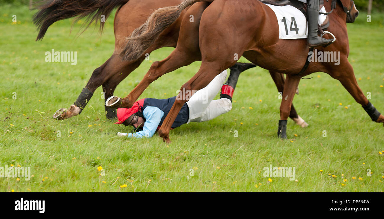 Horse rider dragged by horse Stock Photo