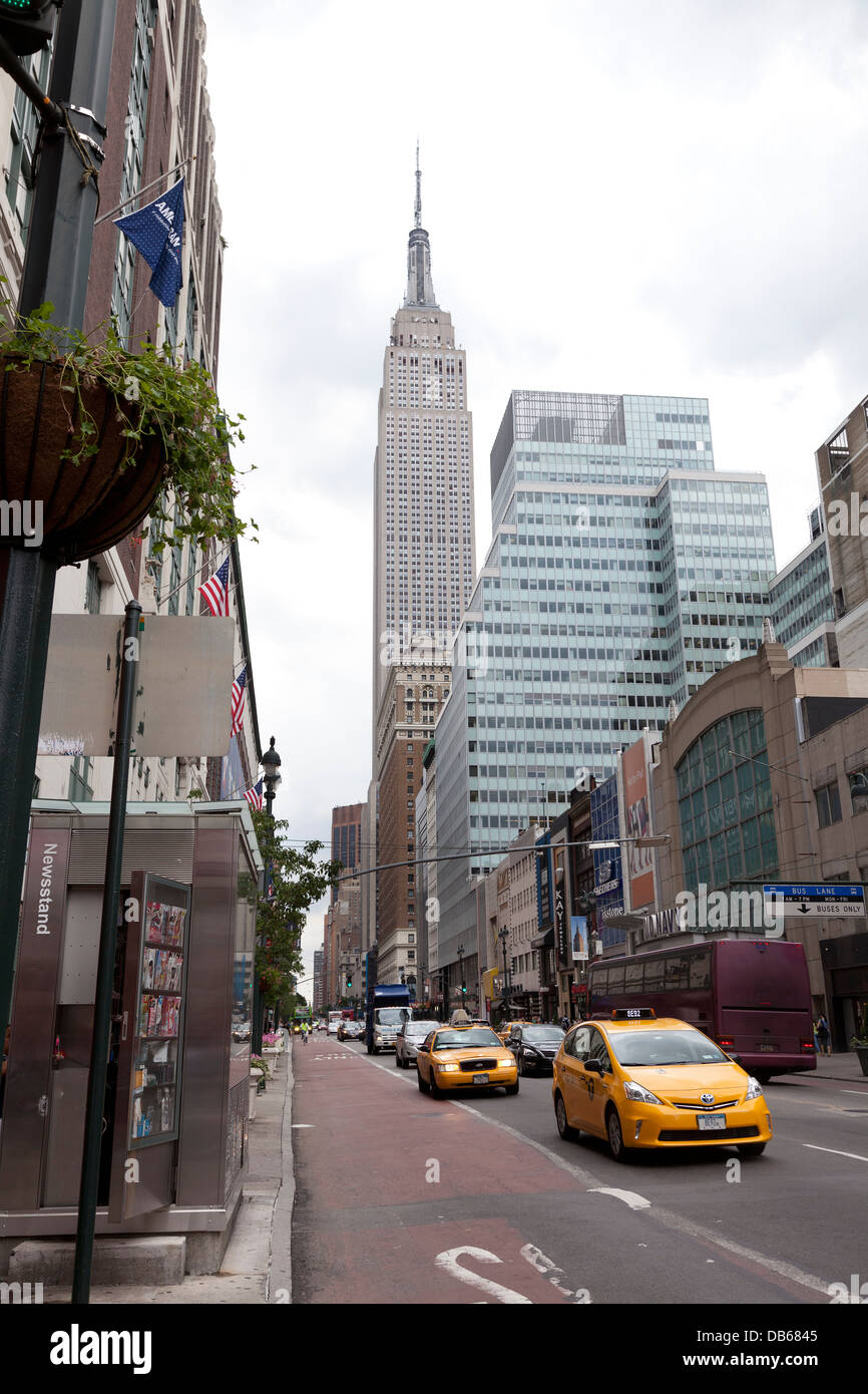 The Empire State building at the end of the street in New York City Stock Photo