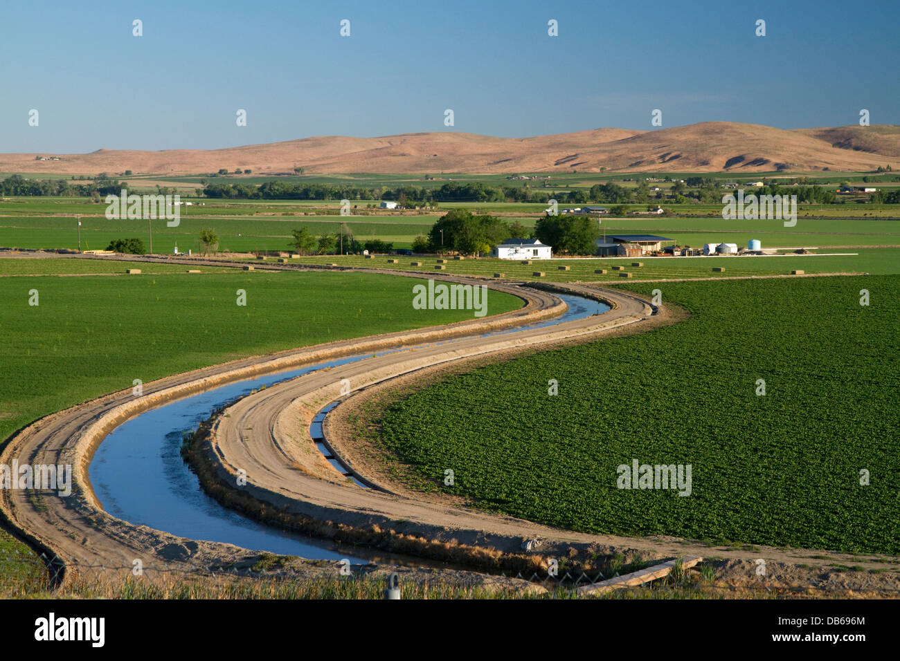 Farmland and irrigation canal near Vale, Oregon, USA. Stock Photo