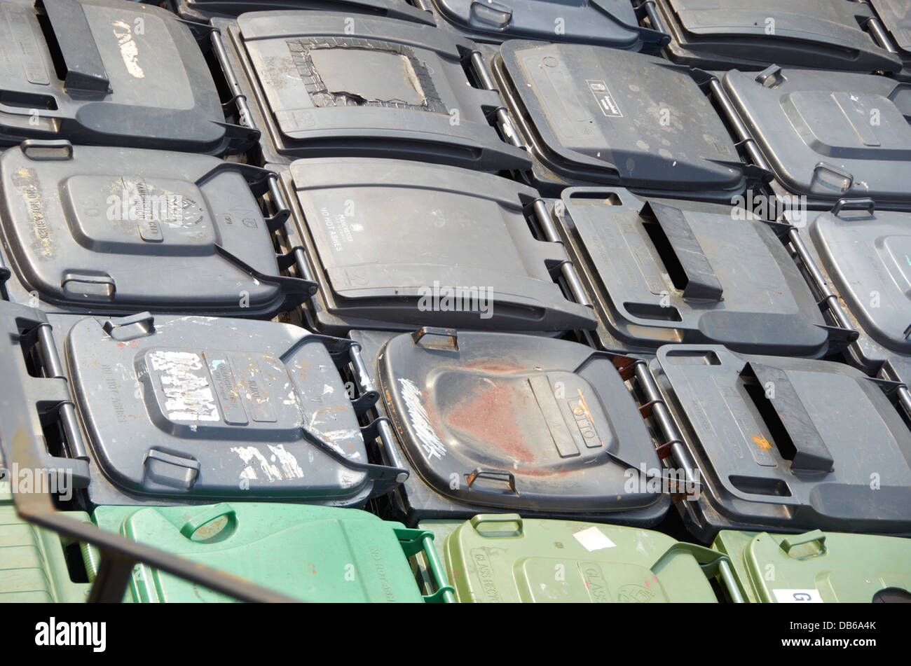 Rows of plastic rubbish bins at a recycling company in the UK Stock ...