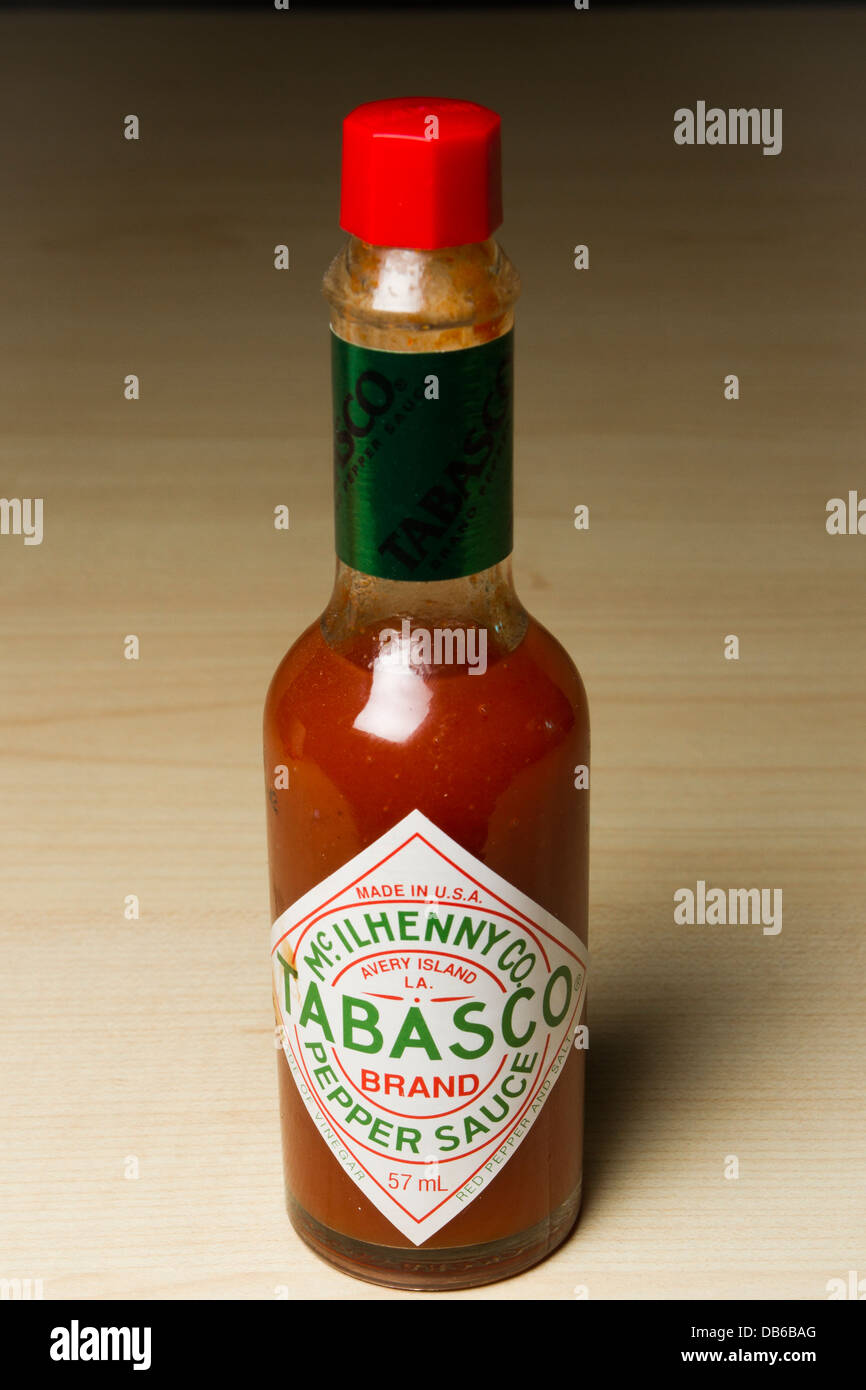 Bottle of Tabasco, hot spicy pepper sauce on a table, England, UK Stock Photo