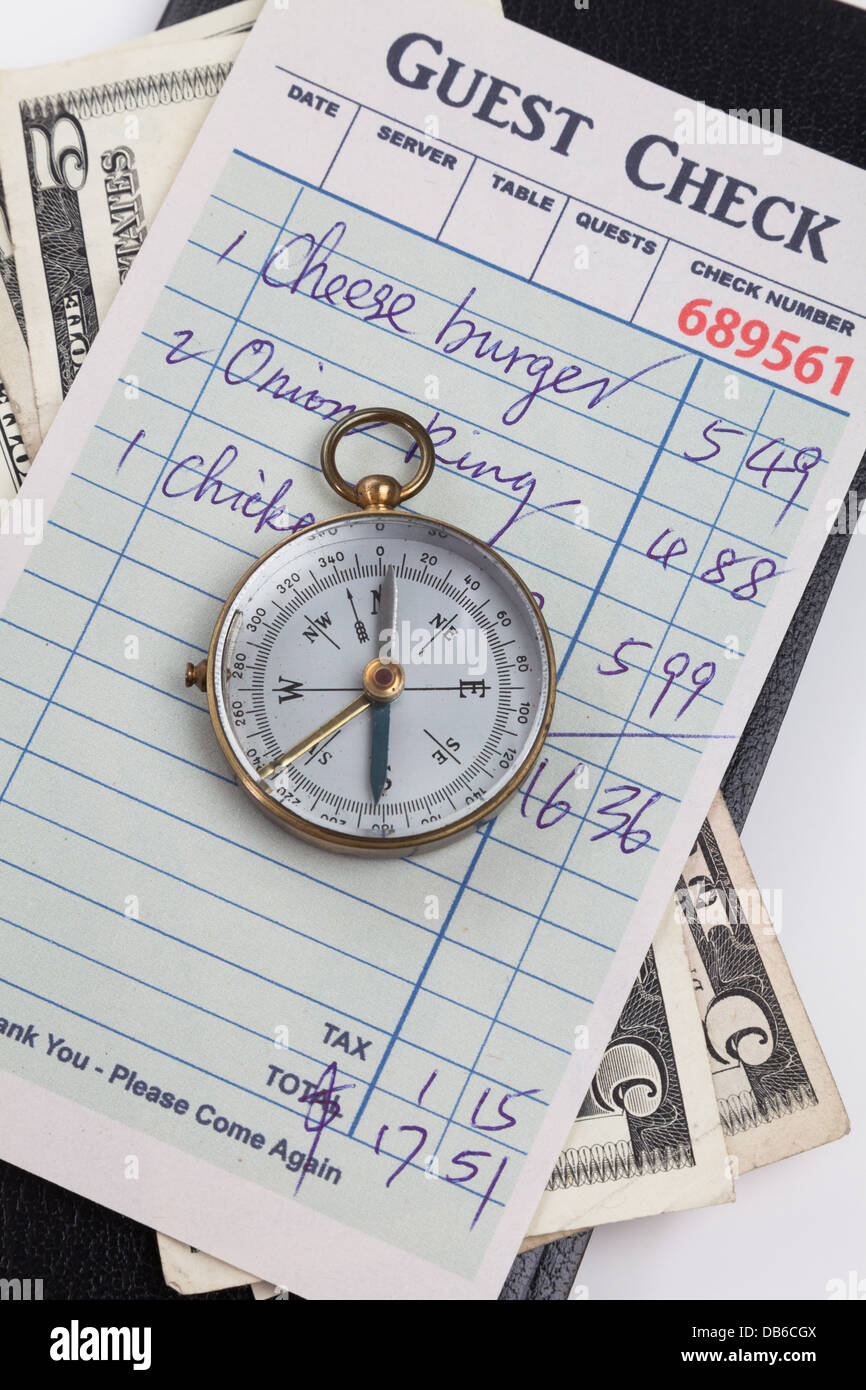 guest check and compass concept of restaurant expense stock photo restaurant expense
