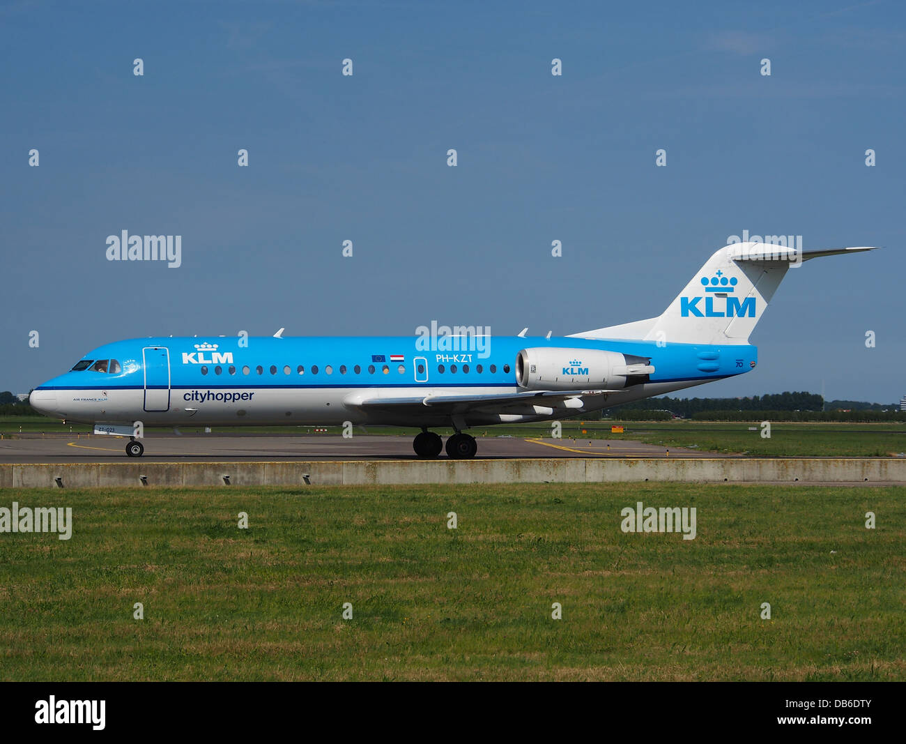 The KLM Cityhopper Fokker 70 (PH-KZT) is a regional airliner used for short-haul flights. Known for its efficiency and comfort, the aircraft serves routes within Europe as part of KLM's fleet. Stock Photo