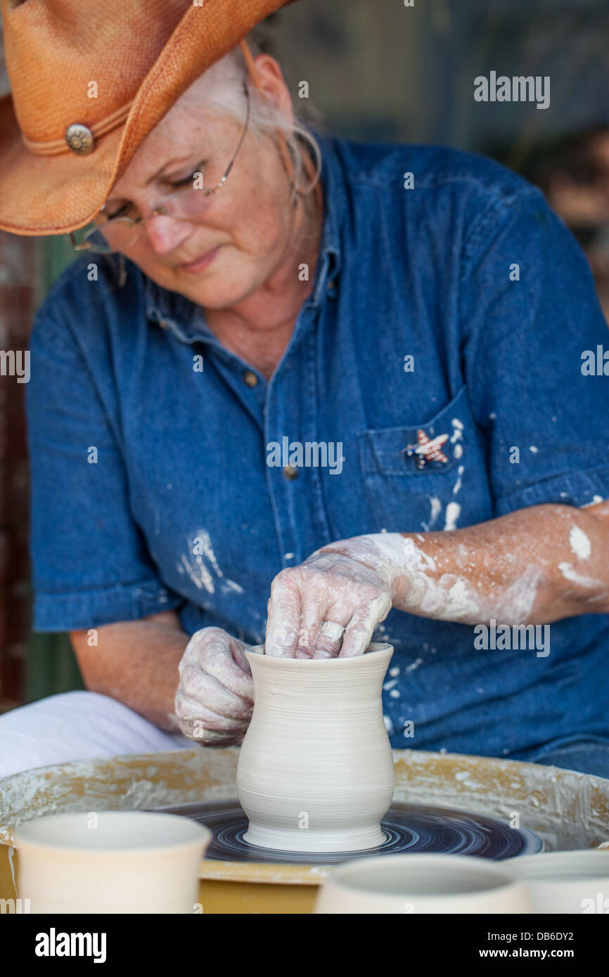Middle Aged Woman Making Pottery in Texas Stock Photo