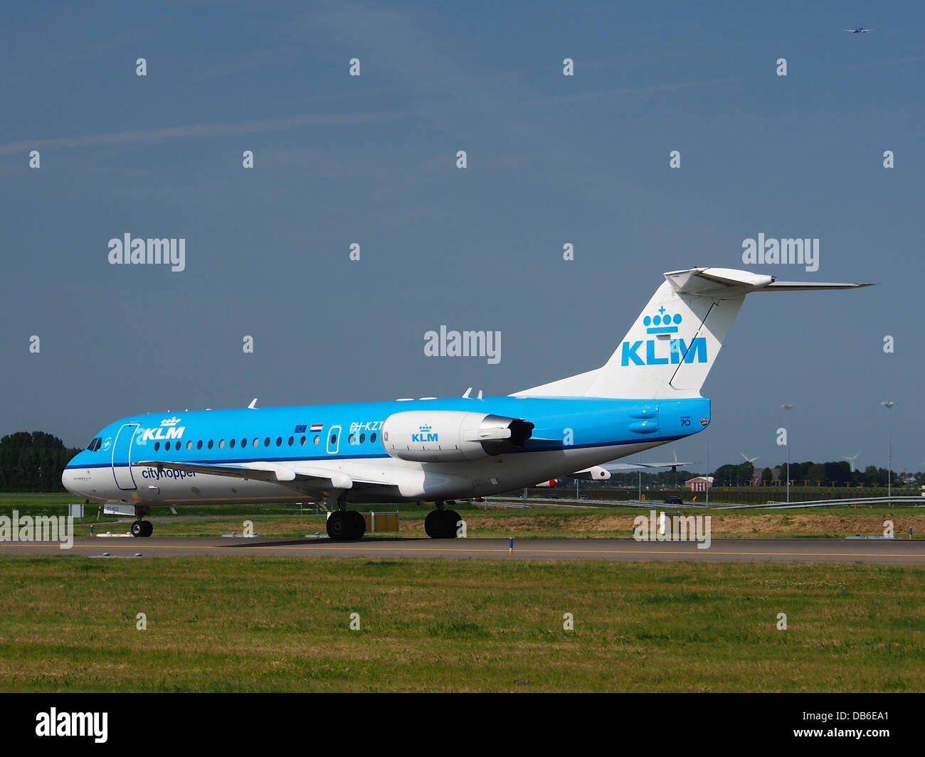 The PH-KZT, a Fokker 70 operated by KLM Cityhopper, is a regional aircraft used for short-haul flights. Known for its compact size and efficiency, it is ideal for domestic and European routes. Stock Photo