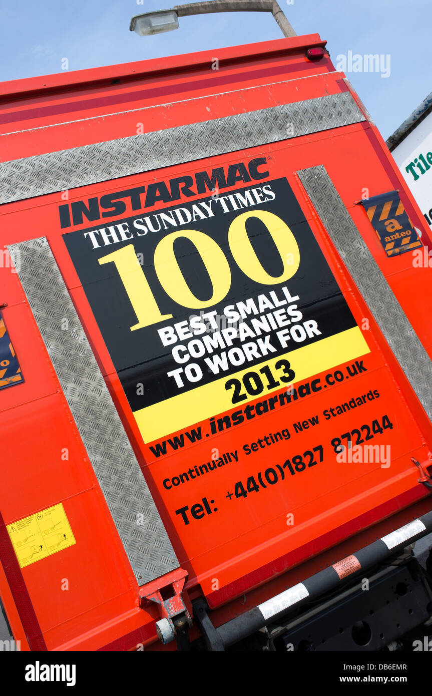 Sunday Times 100 best small companies to work for poster on the back of an Instarmac lorry UK Stock Photo