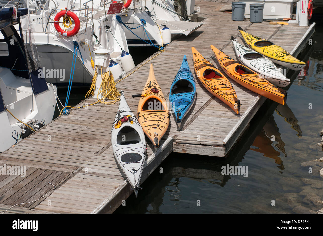 Various colored kayaks on a dock on Granville island Vancouver BC Stock Photo Alamy