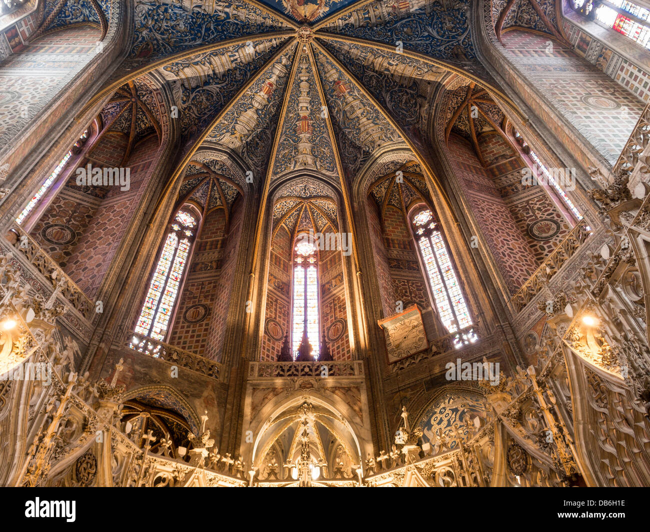 Dome above the Choir. The decorated dome and windows above the ornately carved choir at the Cathedral of Saint Cecil. Stock Photo