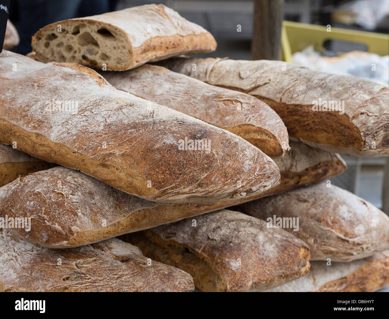 Loaves of whole wheat bread stacked in the market. Large loaves of