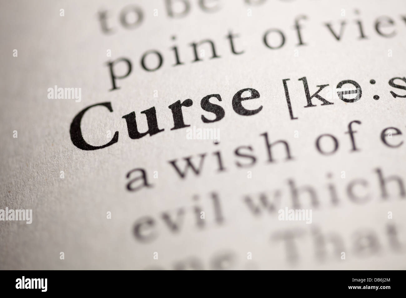 Fake Dictionary, Dictionary definition of the word Curse Stock Photo - Alamy