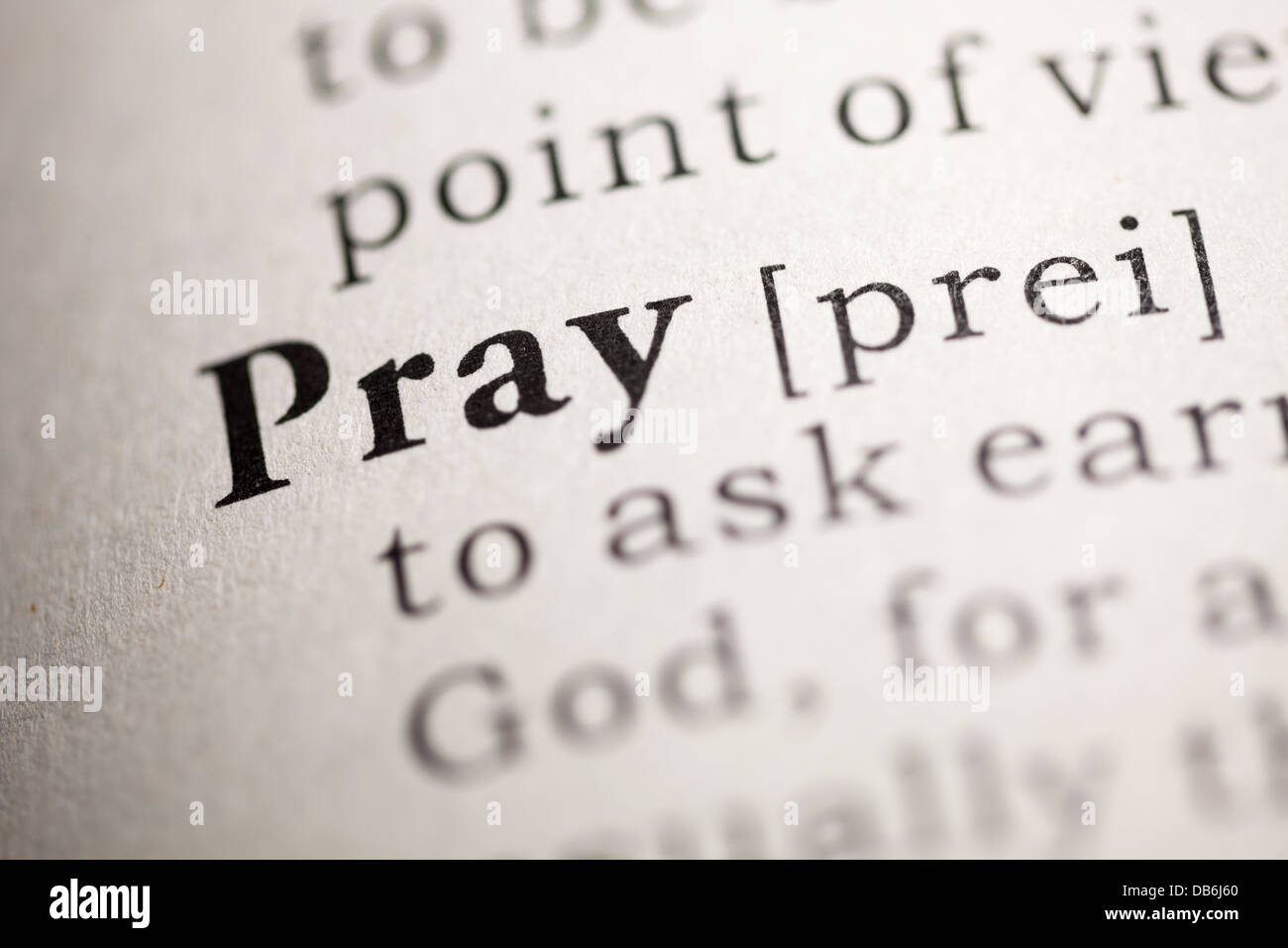 Fake Dictionary, Dictionary definition of the word Pray. Stock Photo