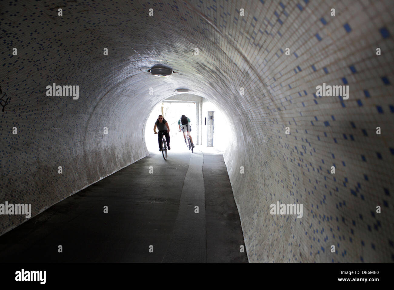 Cyclists in the underground passage, Budapest, Hungary Stock Photo