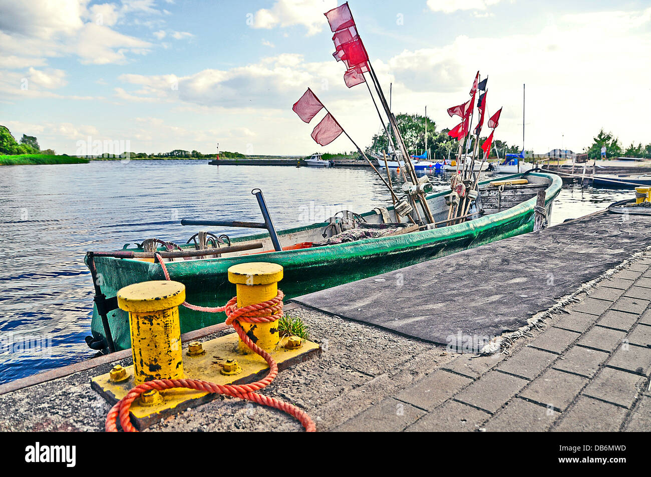 An image of boat docked at the wharf Stock Photo - Alamy