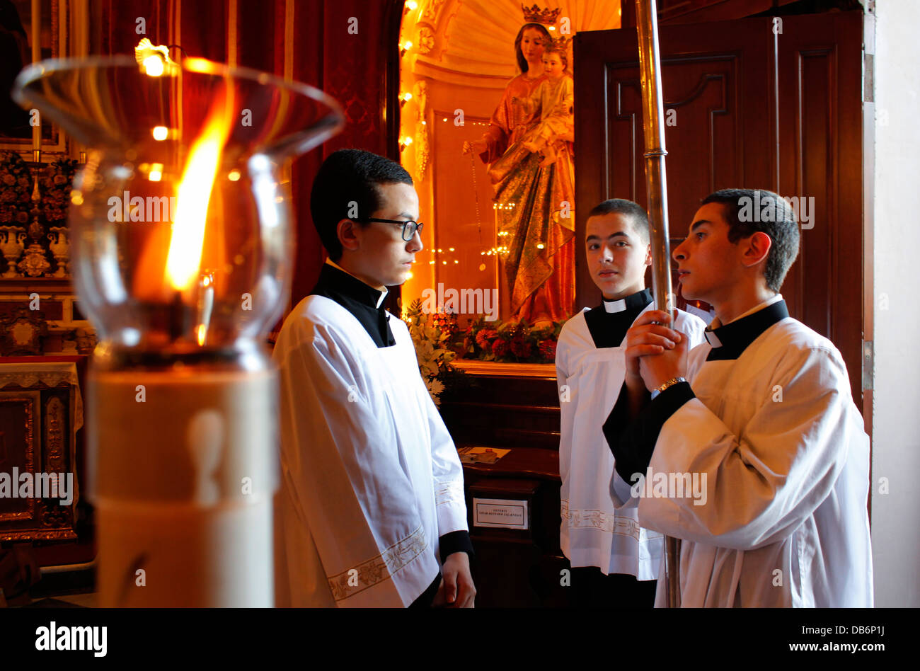 Young altar boys inside St Gregory the Great church in the village of